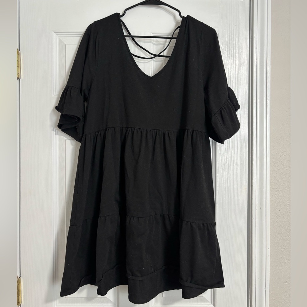 Black dress with cross back and sleeve detail
